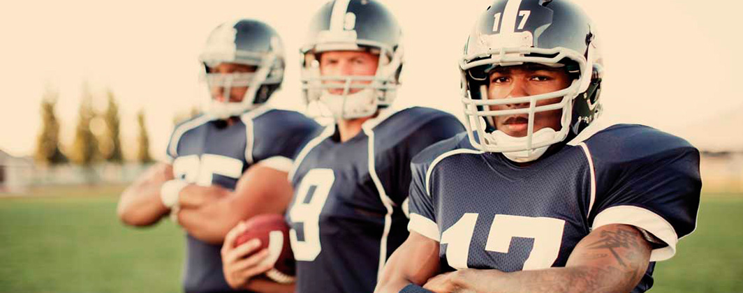 three football players in uniform